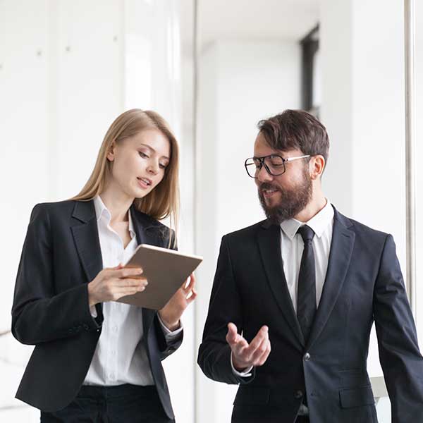 Two business people discussing